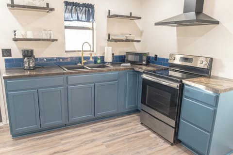 Fully equipped kitchen with modern appliances and everything you need to cook meals during your stay.