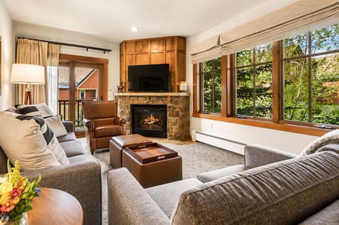 Bright, cozy living room with fireplace. Perfect for relaxing after a short walk back from the slopes.