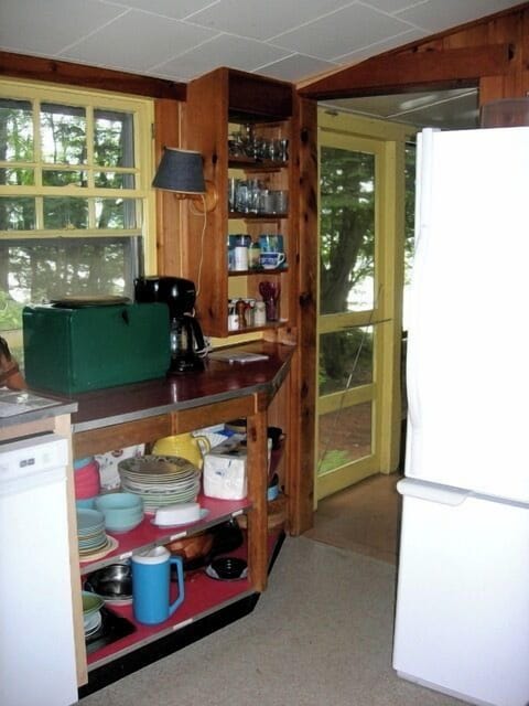 Your cozy kitchen features warm wood cabinetry, essential appliances, and plenty of storage for all your culinary adventures.