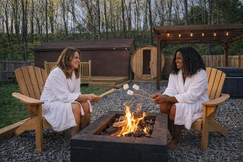 Unwind under the stars, cozy robes, crackling fire, and s’mores by the fire pit 