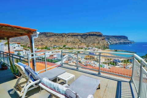 There is an enormous roof terrace with incredible views looking out over Playa de Mogan and the marina