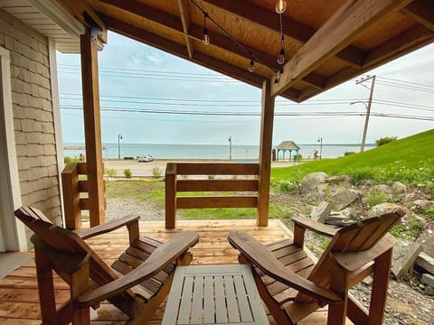 Fall for this covered terrace: salty air, BBQ, dining table, beach views!