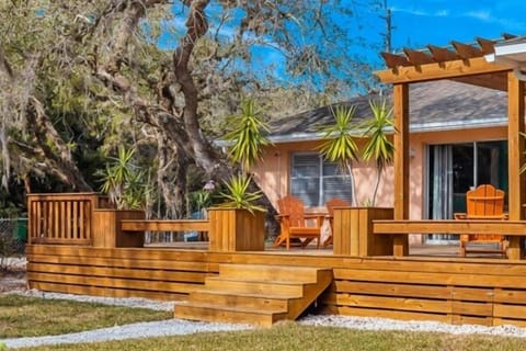Spacious front deck, tropical landscaping, and plenty of room to relax with your morning coffee or unwind after a beach day.