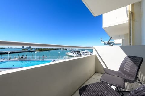 Relax with poolside and marina views from your private balcony—ideal for beach lovers and boat watchers.