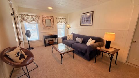 Cozy living room with comfortable seating, bright natural light, and inviting spaces.