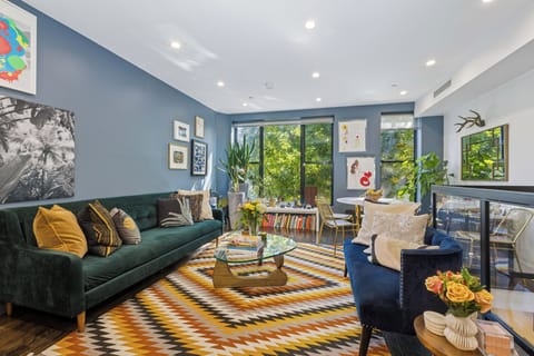 Light-filled living room with garden views and curated art.