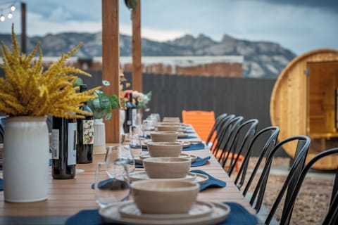 Dinner under the pergola with Rocky Mountain views as your backdrop.