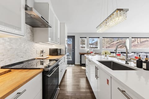 Updated kitchen with stainless steel appliances and everything needed to cook a meal at the home after a day in the mountains.