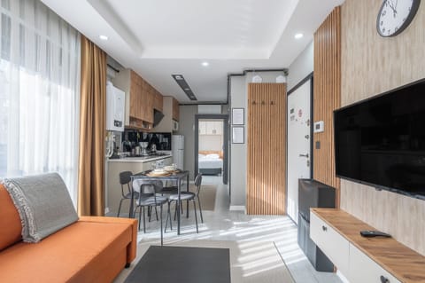 Deluxe Apartment, 1 Bedroom, Kitchen | Living area | 80-cm TV with cable channels, Netflix, streaming services