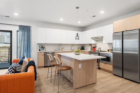 Open-concept kitchen with modern appliances and bar seating