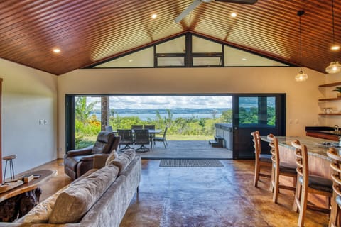 Bring the outside in with an expansive view of Lake Arenal and all of the visiting wildlife.