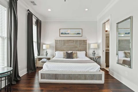 Our comfy King size bed with white linens and blanket. 