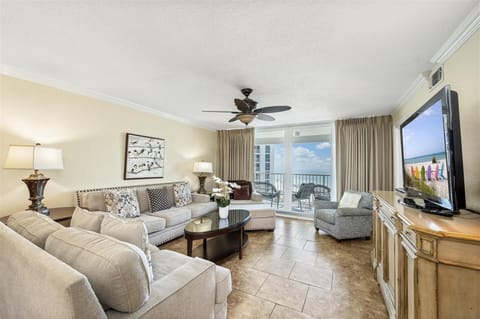 Relax in your elegant living room with plush seating and stunning ocean views from your private balcony.