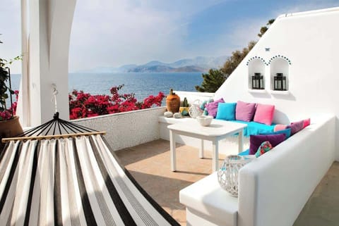 Scenic Waterfront Veranda with Relaxing Hammock and Lounge Space