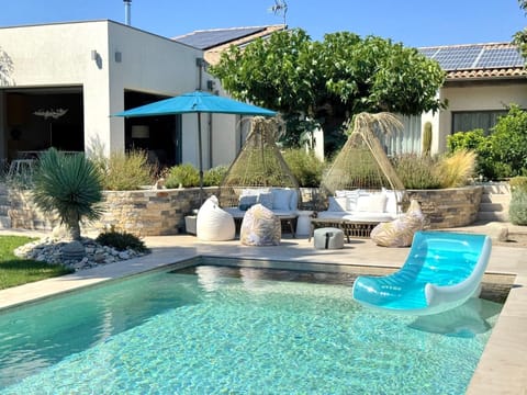 Seasonal outdoor pool, open 9:00 AM to 8:00 PM, pool umbrellas