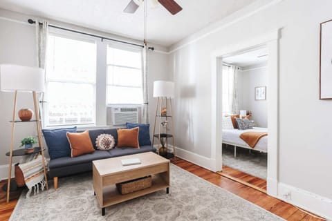 Filled with natural light and inviting furnishings, this cozy living area is designed for comfort and relaxation.