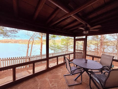 Dine on the screened-in back patio with lake views
