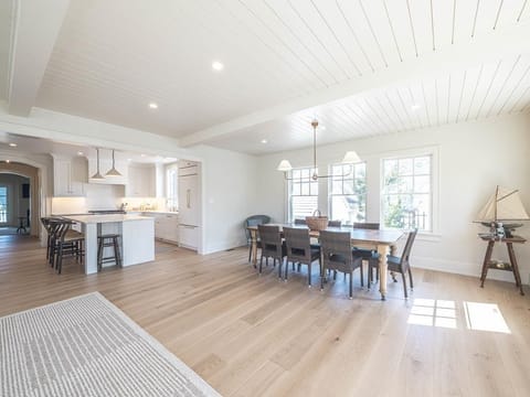 An inviting dining area that connects seamlessly to the kitchen, bathed in natural light, ideal for family gatherings.