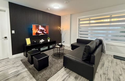 Living room with super comfortable leather sofa bed, LG Television with over 2000 channels. 