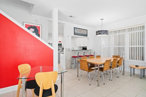 Open-concept living and dining space with stylish furnishings, perfect for relaxing and sharing meals together.