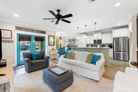 Open & inviting living area with comfortable seating & sofa sleeper.