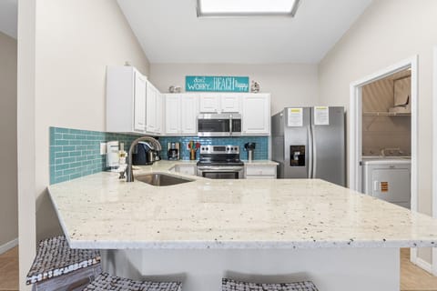 Three comfortable stools at the counter - great for quick snacks or beverages.