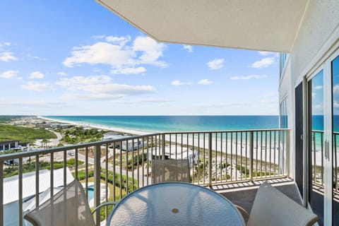 Furnished private balcony with seating for enjoying morning coffee, sunsets, and ocean breezes high above the shoreline.