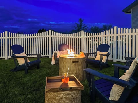 Relax by the firepit with Adirondack chairs & yard views
