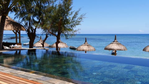 Outdoor pool, pool umbrellas, sun loungers