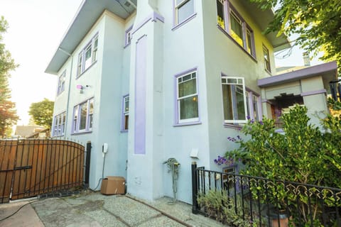 This charming exterior welcomes you with classic architecture, lush landscaping, and convenient access to the private driveway for easy arrivals
