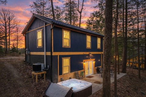 Hot tub patio behind the cabin, surrounded by peaceful forest in the heart of Red River Gorge.