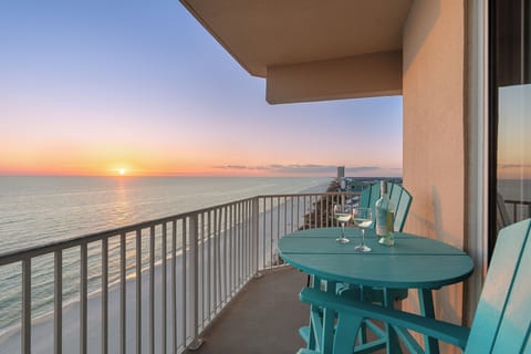 Private Gulf-front balcony with sweeping shoreline views — the perfect spot for sunset wine and unwinding above the sand.