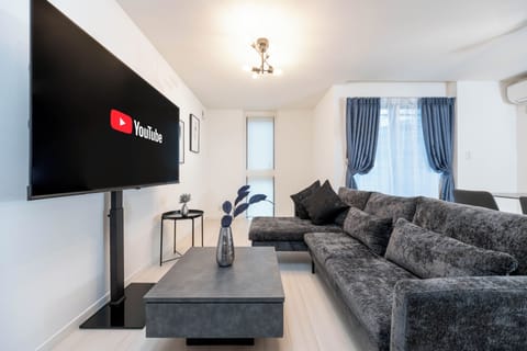Comfort House, 4 Bedrooms, Non Smoking, Private Bathroom | Living area | 60-inch LCD TV with cable channels, Netflix, pay movies