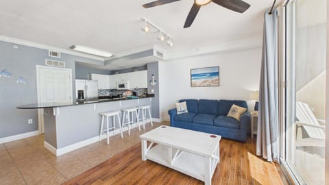 Open concept living area with stylish furnishings and sleeper sofa + balcony access (sleeps 2)