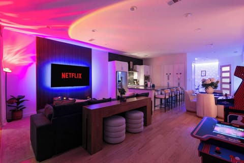 Set the mood for movie nights with immersive lighting and a streaming ready TV. A perfect space to unwind, celebrate, or enjoy a cozy evening in.
