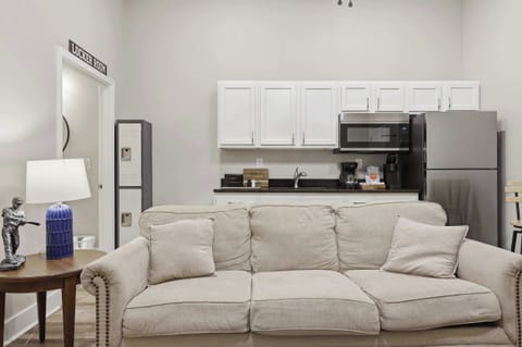 Unit 3 Living Area: Relax in this cozy living space with kitchenette, perfect for unwinding after exploring Churchill Downs and Louisville’s top eateries nearby.