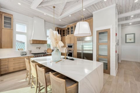 Your dream kitchen awaits with stunning exposed beams, sleek marble counters, and professional appliances perfect for memorable meals.