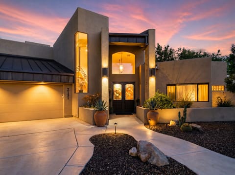 Front exterior with private driveway and generous parking.