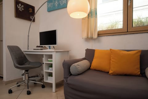 Comfort Room | Living area | 30-inch TV with satellite channels