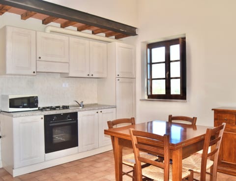 Family Duplex | Private kitchen | Full-size fridge, oven, cookware/dishes/utensils, dining tables