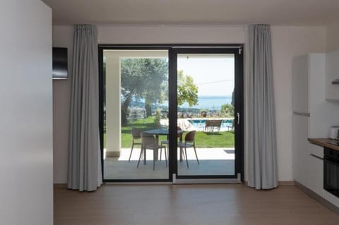 Apartment, Patio, Lake View | Private kitchen