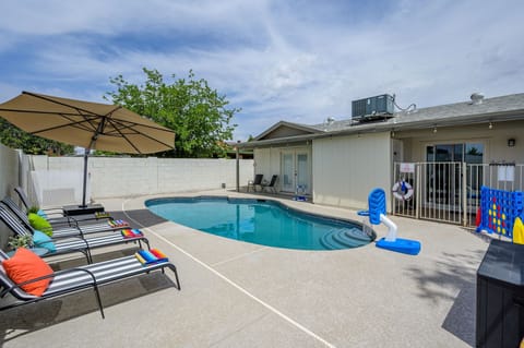 Private pool with lounge seating for relaxing outdoors.