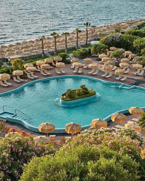 Indoor pool, outdoor pool, pool umbrellas, sun loungers