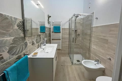 Quadruple Room | Bathroom | Shower, hair dryer, towels, soap