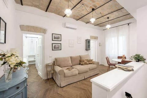 Sitting room with area for dinning. The sofa can be also use as a sigle bed.