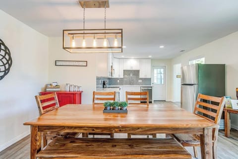 Large dining table with seating for the whole group — perfect for family meals, game nights, or morning coffee together.