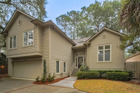 The Fairway House is a two story home within the gated Sea Pines community.