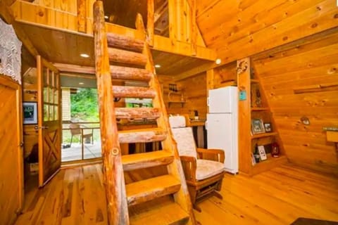 Captains stairs to bedroom with queen bed.