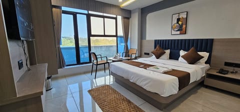 Deluxe Double Room, City View | Pillowtop beds, desk, laptop workspace, iron/ironing board