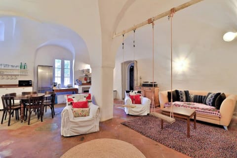 Vaulted living room with swings — playful, warm, unforgettable.